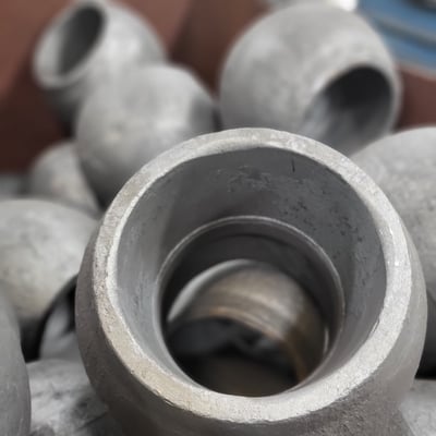 Close-up of round forged steel housings stacked together, showing precise interior machining and surface quality that reflect SSP’s forging expertise.